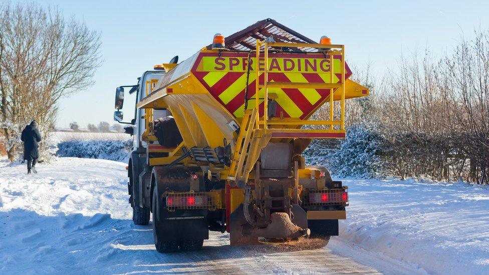 A road gritter lorry on a snowy road