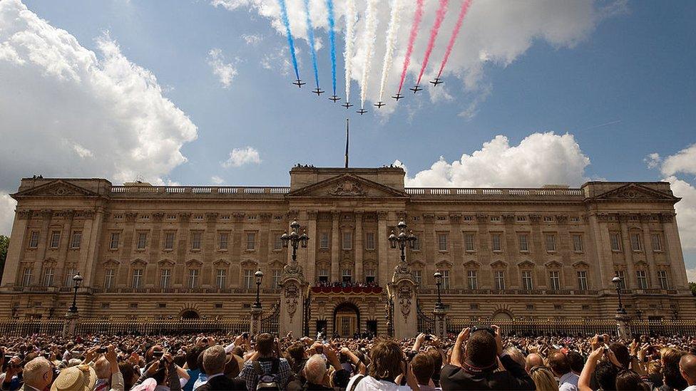 The Red Arrows display team fly over Buckingham Palace following the Queen's Birthday Parade