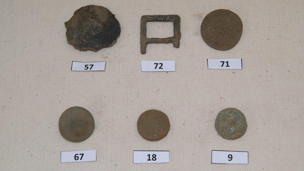 A buckle and buttons were among the items unearthed in the survey