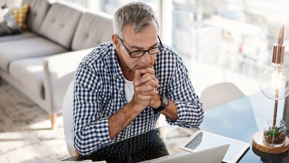 Middle-aged man working at laptop