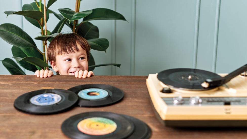 boy-listening-to-record-player