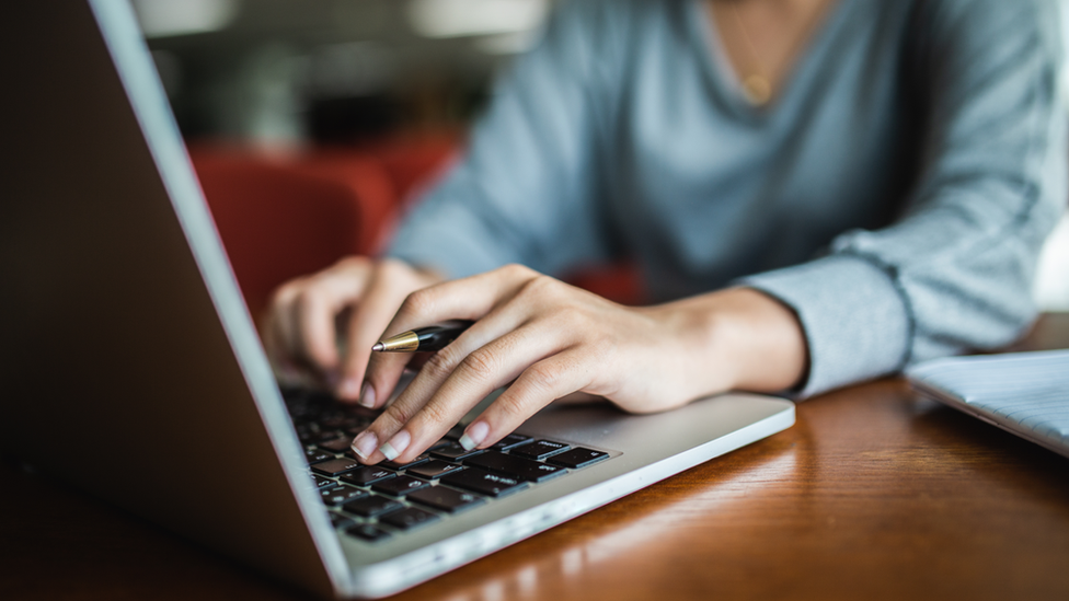 Person working on a laptop computer