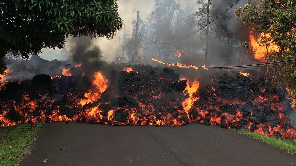 Lava covers a tarmac road