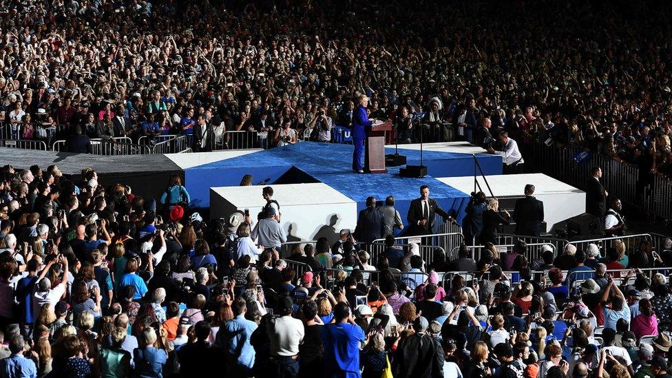 Hillary Clinton on stage at a rally