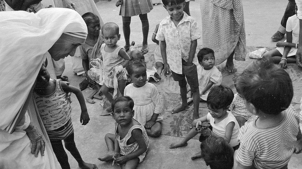 Mother Teresa talks with and blesses the orphans at her Sishu Bhavan (Children's Home) in Kolkata, India