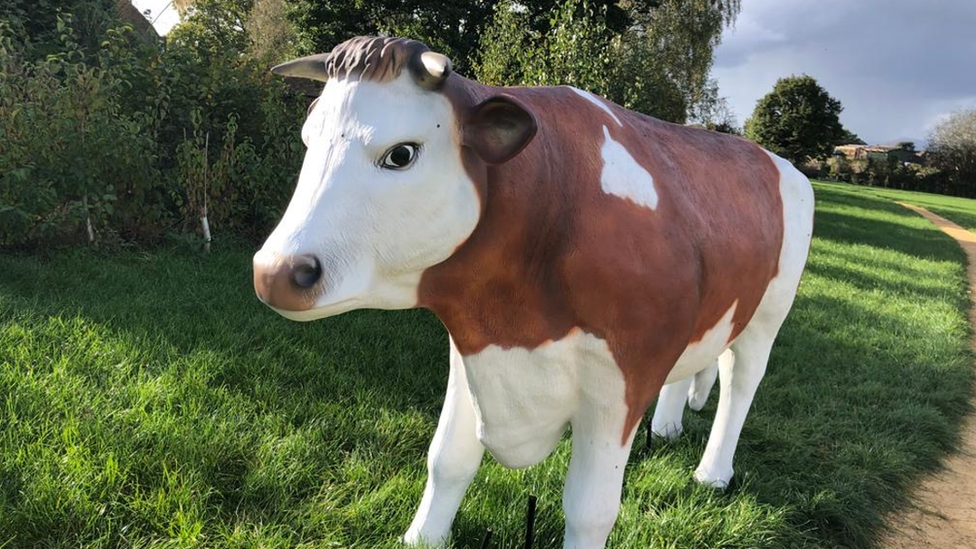 Fibreglass bull in a field