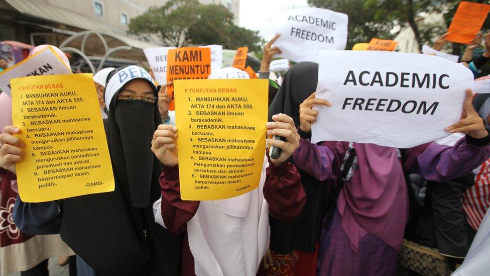 Students display placards reading 'Academic Freedom' during a protest in downtown Kuala Lumpur in 2011