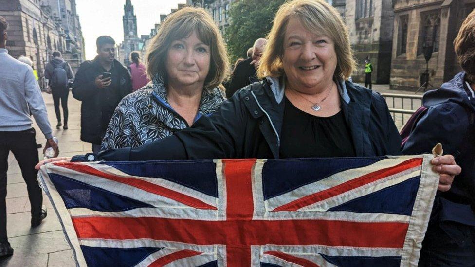 Linda Greenshields and flag