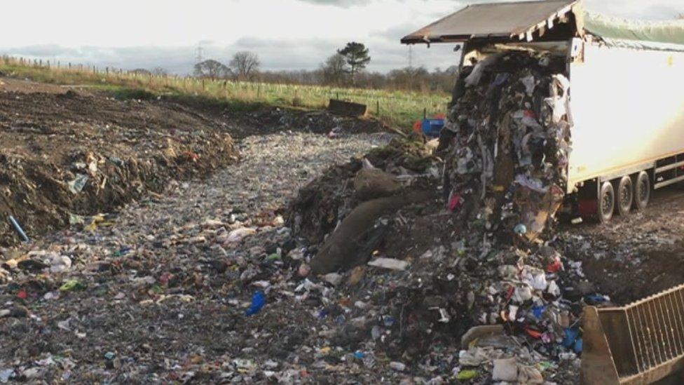 An articulated lorry empties its load at Hafod Landfill site