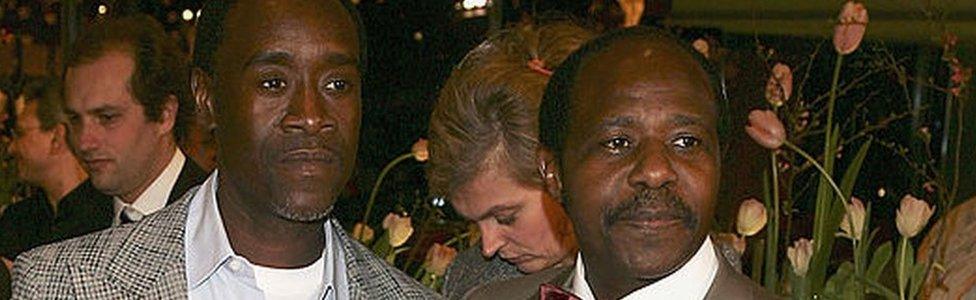 Actor Don Cheadle (L) and Paul Rusesabagina arrive at the "Hotel Rwanda" Premiere during the 55th annual Berlinale International Film Festival on February 11, 2005 in Berlin, Germany.