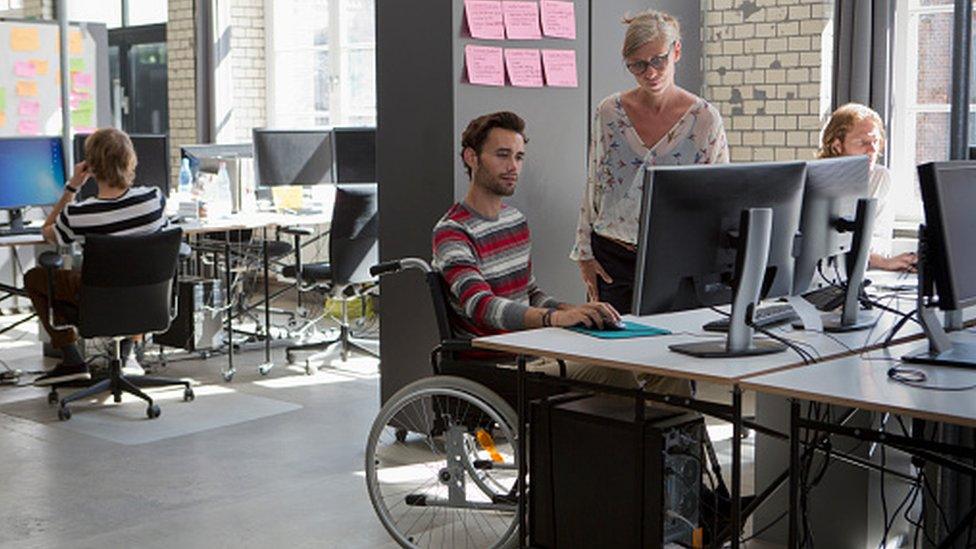 Man and woman working in office