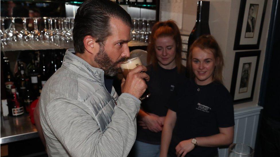 Donald Trump Jr sips a pint and meets locals in a Doonbeg pub