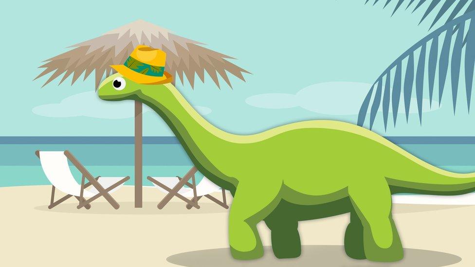 dinosaur with a hat on the beach