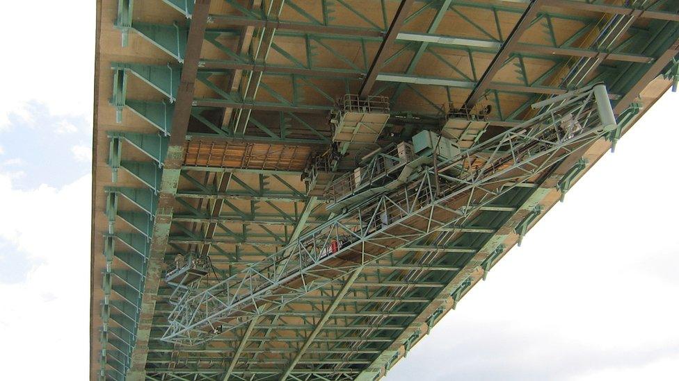 Painters finish thee the weatherproof paint job 449 feet above the treacherous River Severn