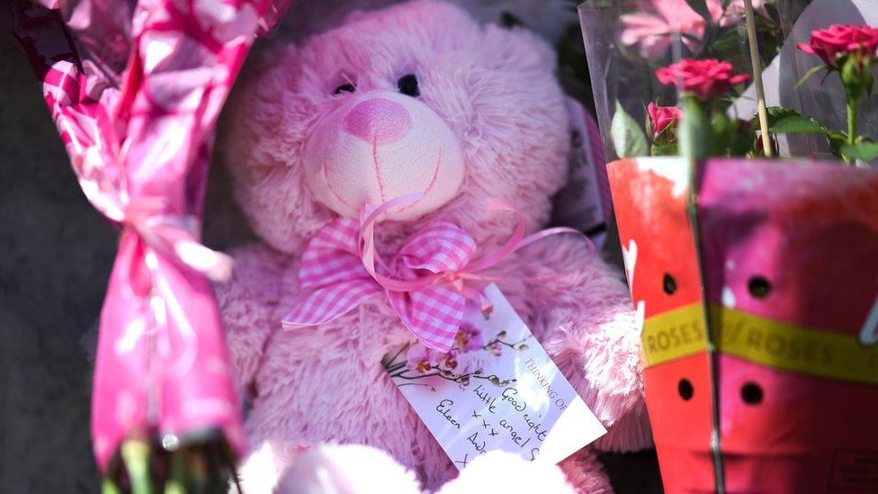 Tributes outside a house on Ardbeg Road