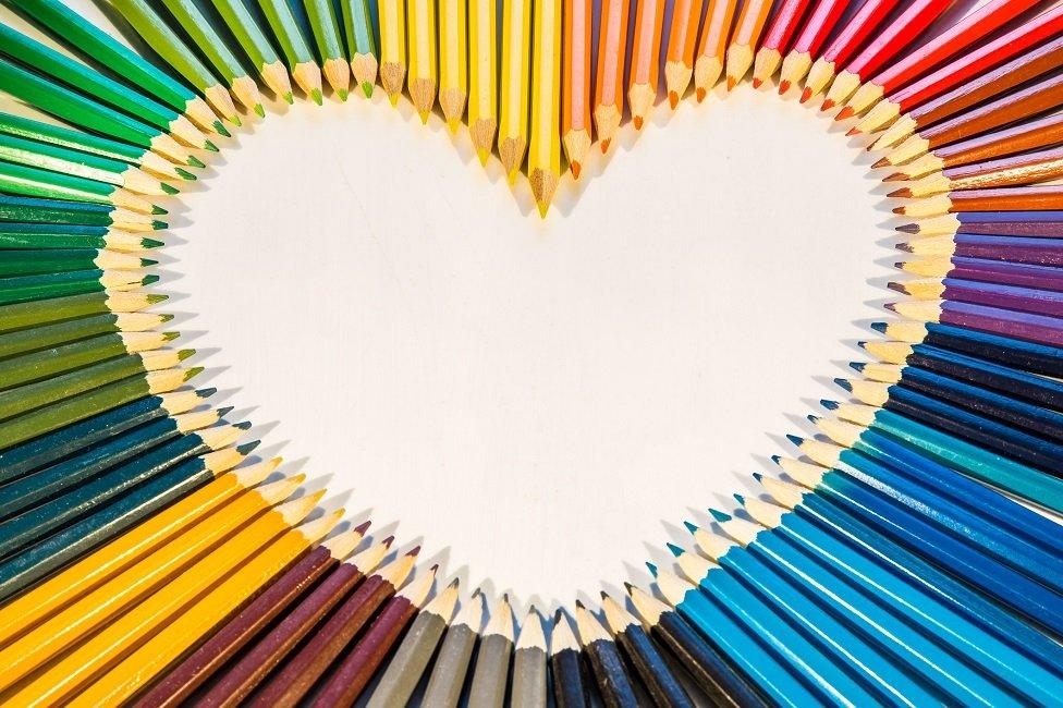 Rainbow heart made of pencils