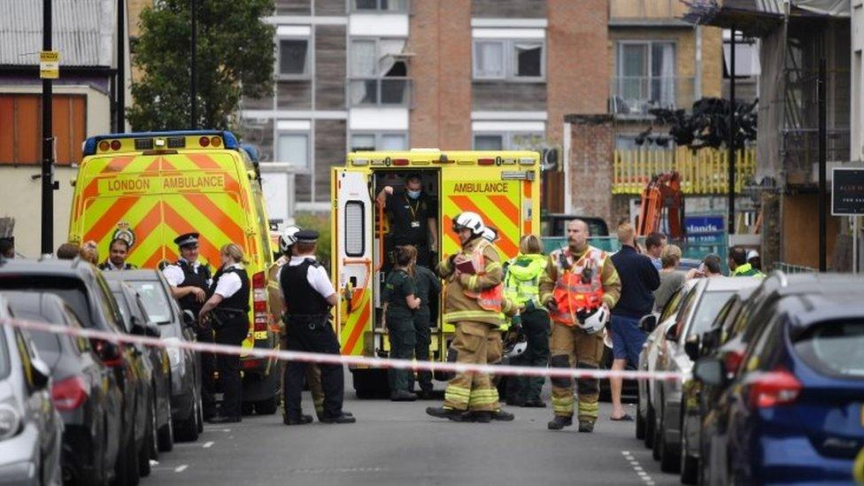 A crane crashed on to the development and two terrace houses in Compton Close, Bow