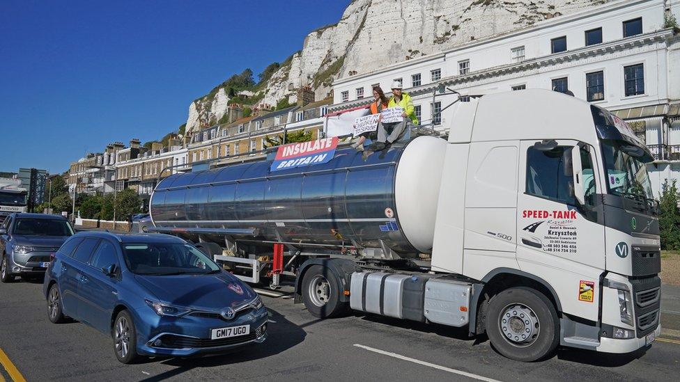 Protesters from Insulate Britain sit on top of a vehicle as they block the A20 in Kent