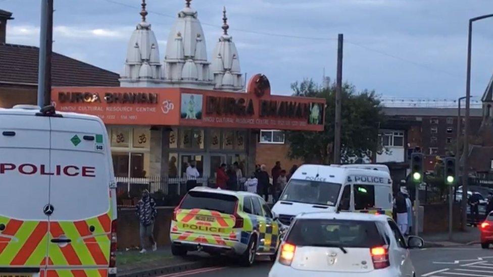 Police vans outside a Hindu Temple