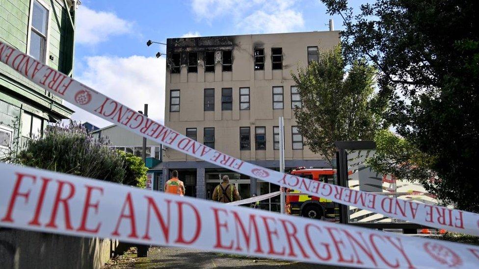 The burnt exterior of the Loafers Lodge hostel in New Zealand