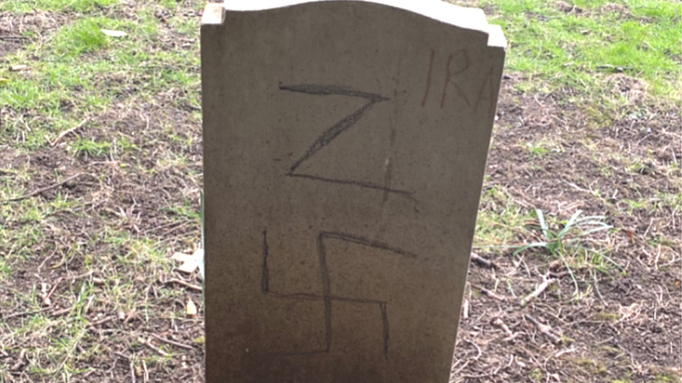 Graffiti on gravestone