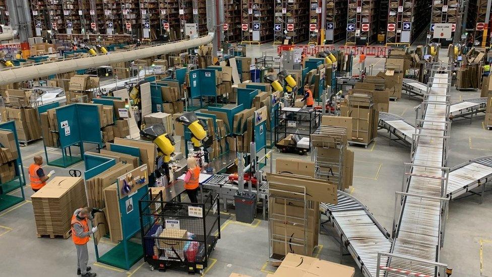 Workers in an Amazon warehouse