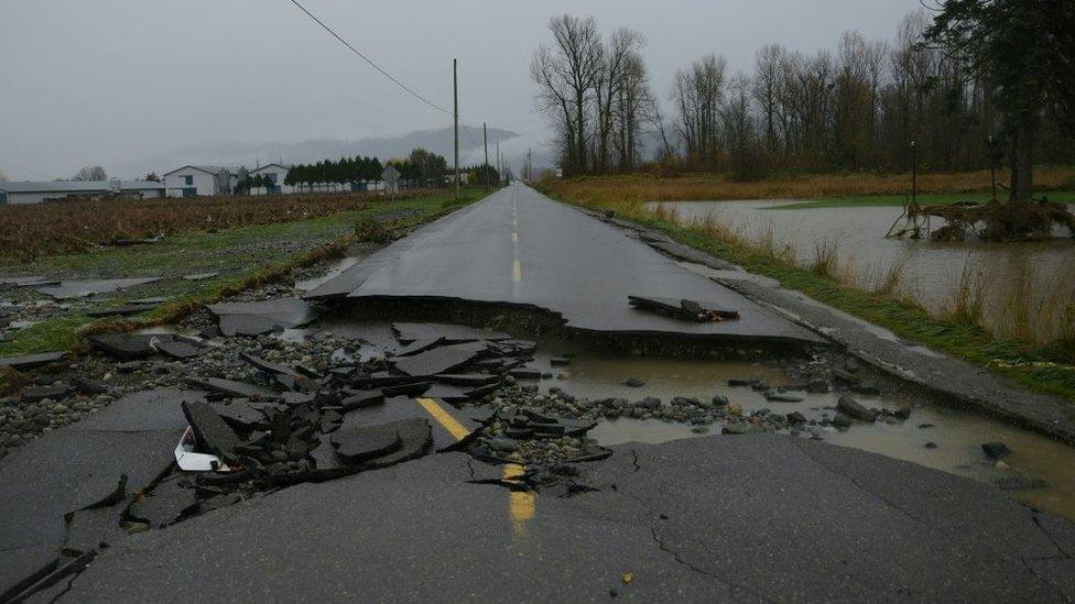 Damage from severe flooding is seen in the Sumas Prairie area of Abbotsford, British Columbia south of a closed Hwy 1, on November 18, 2021.