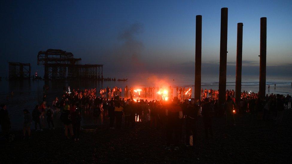 Fire performers attract crowds as night falls on Brighton beach