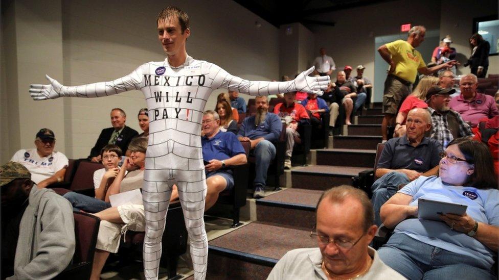 An Iowa man wears a wall outfit in honuor of Trump's pledge to build a US-Mexico border wall