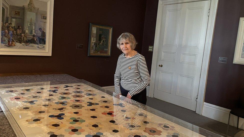 Olga Henderson with her quilt