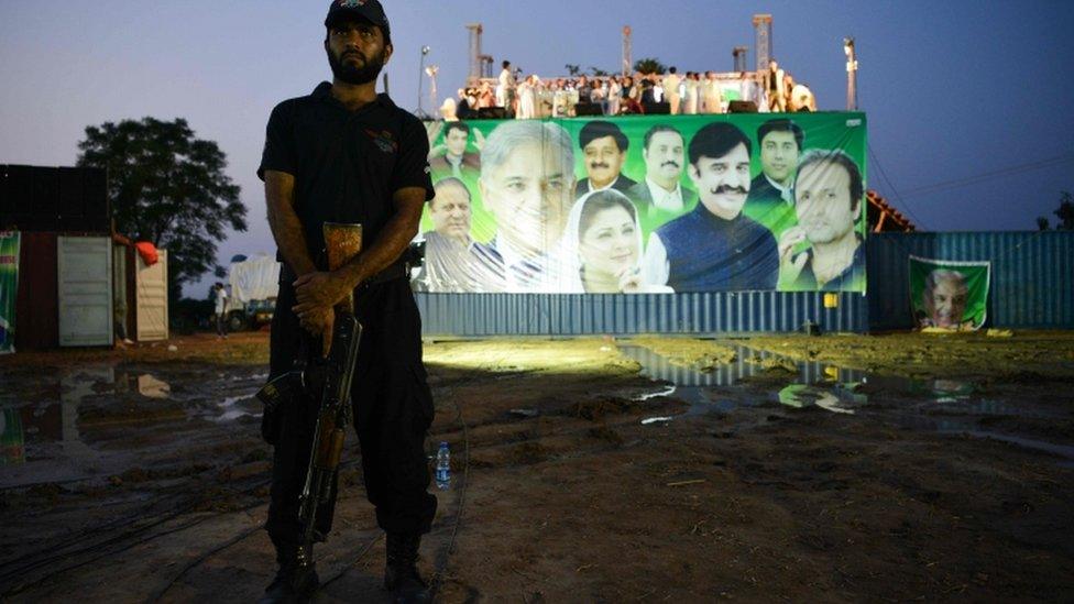 Soldier in front of an election poster