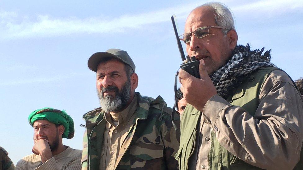 General Ali al-Hamdani (with walkie-talkie) ordering an al- out attack on IS positions