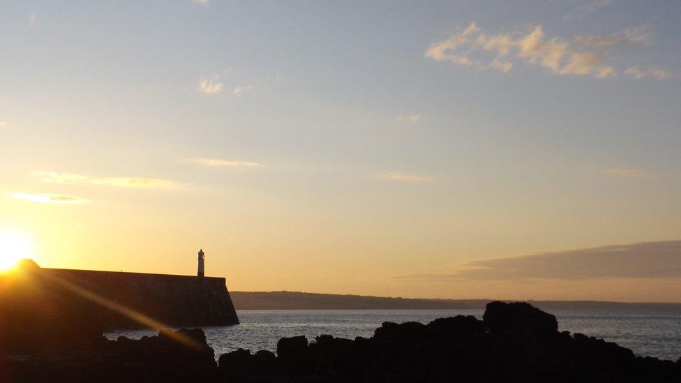 Sunrise over pier