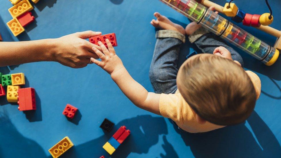 child playing with lego