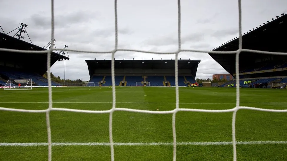 A view of the Kassam Stadium behind one of the goals, with the net as part of the picture 