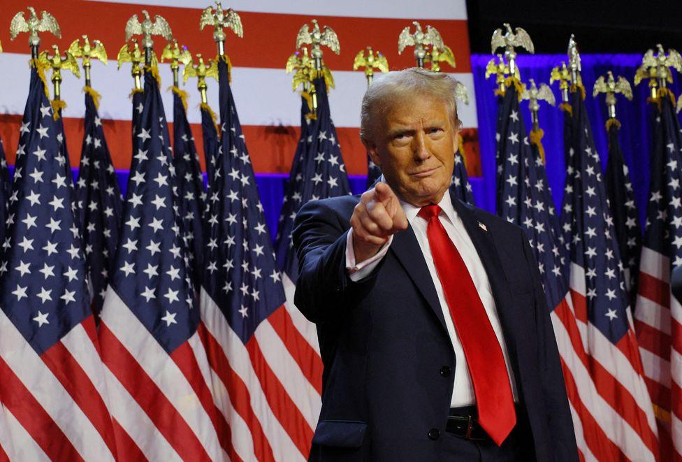 Republican presidential nominee and former US President Donald Trump takes the stage to address supporters at his rally, at the Palm Beach County Convention Center in West Palm Beach, Florida