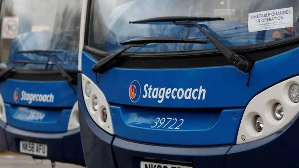 The front bumpers/windscreens of two Stagecoach buses, which are blue, at a depot