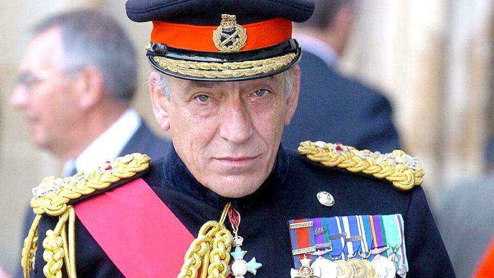 Full face portrait of General Sir Mike Jackson in blue full military dress uniform