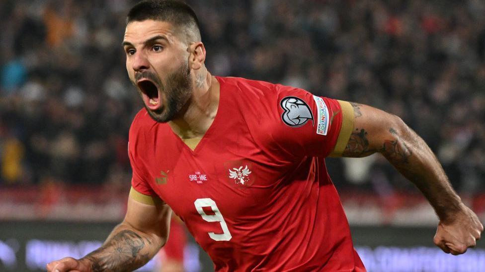 Aleksandar Mitrovic celebrating a goal for Serbia