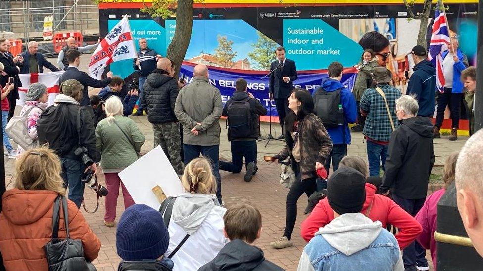 Former Patriotic Alternative activist Alek Yerbury speaking in front of a crowd of people