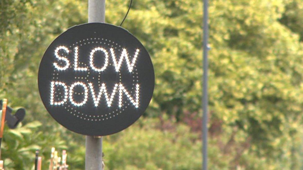 Slow down sign