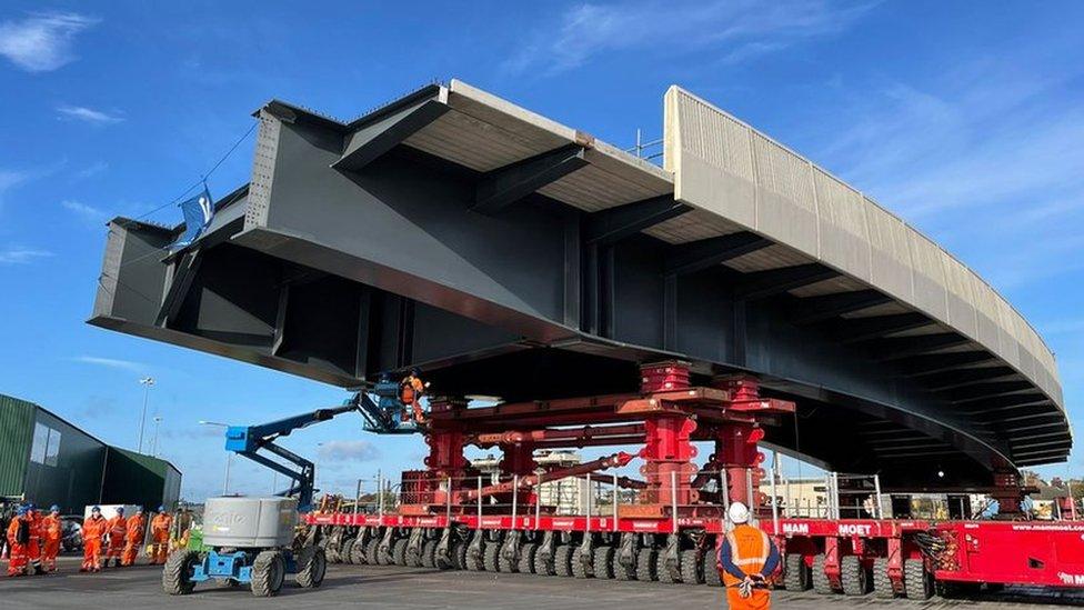 Bridge being moved by specialist equipment on the ground