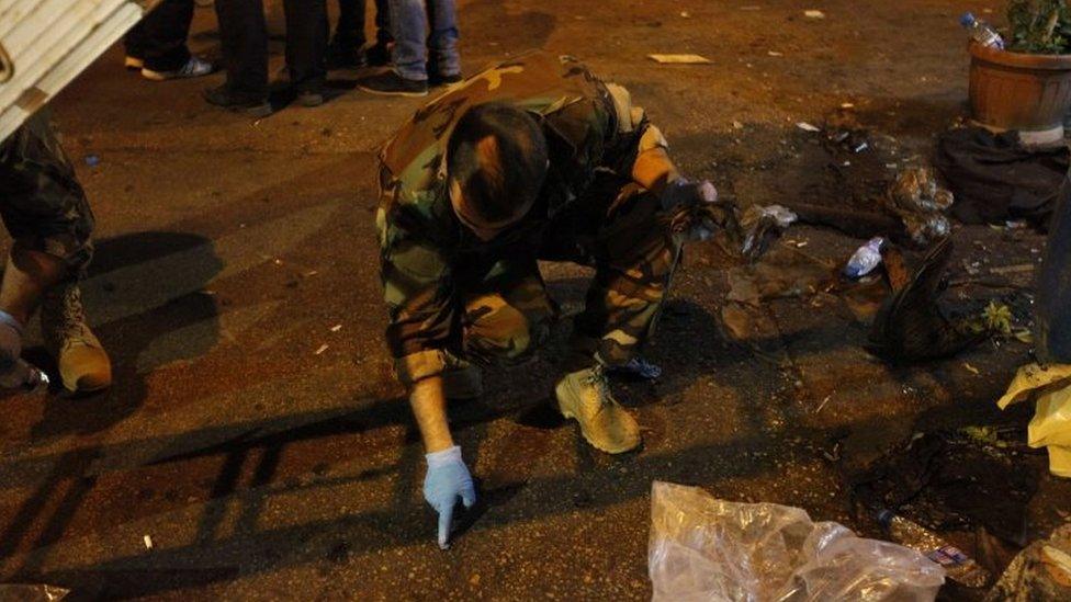 Lebanese army forensics officer gather evidence at the site of a twin suicide bombing in Burj al-Barajneh, Beirut (12 November 2015)