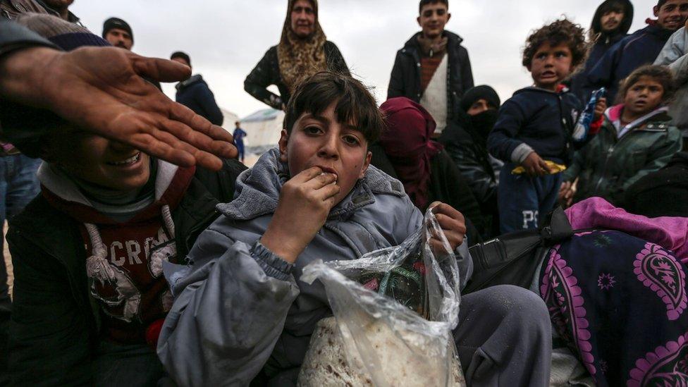 Syrian refugees are pictured in a camp as Syrians fleeing the northern embattled city of Aleppo wait on February 6, 2016 in Bab al-Salam, near the city of Azaz, northern Syria, near the Turkish border crossing