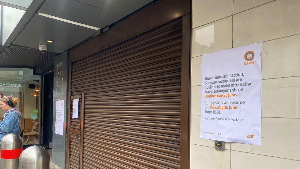 A Glasgow Subway station with shutters down