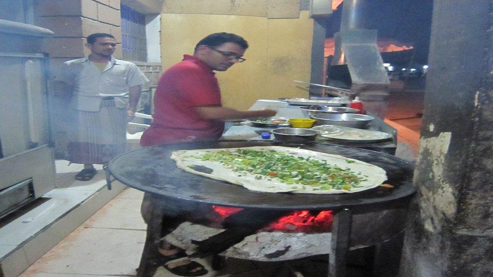 A Yemeni chef preparing a dish.