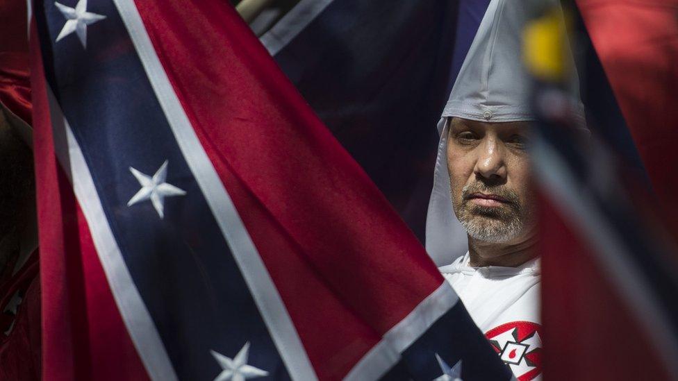 This file photo taken on July 08, 2017 shows a member of the Ku Klux Klan during a rally, calling for the protection of Southern Confederate monuments, in Charlottesville, Virginia