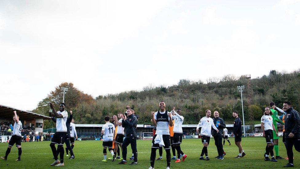 Dover players celebrate at the final whistle