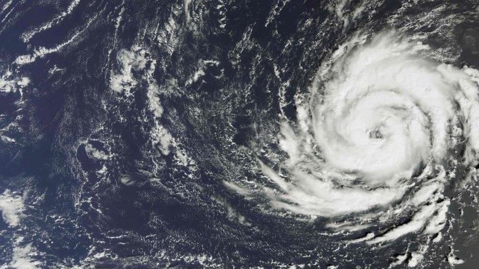 A handout satellite image captured by the The Copernicus Sentinel-3A satellites OLCI instrument on October 11, 2017 and released by the European Space Agency (ESA) on Octob er 15, 2017 shows Hurricane Ophelia over the Atlantic Ocean