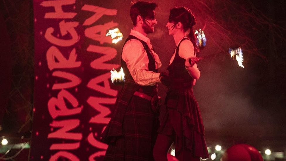 Members of the PyroCeltics perform at a street party in Edinbrugh